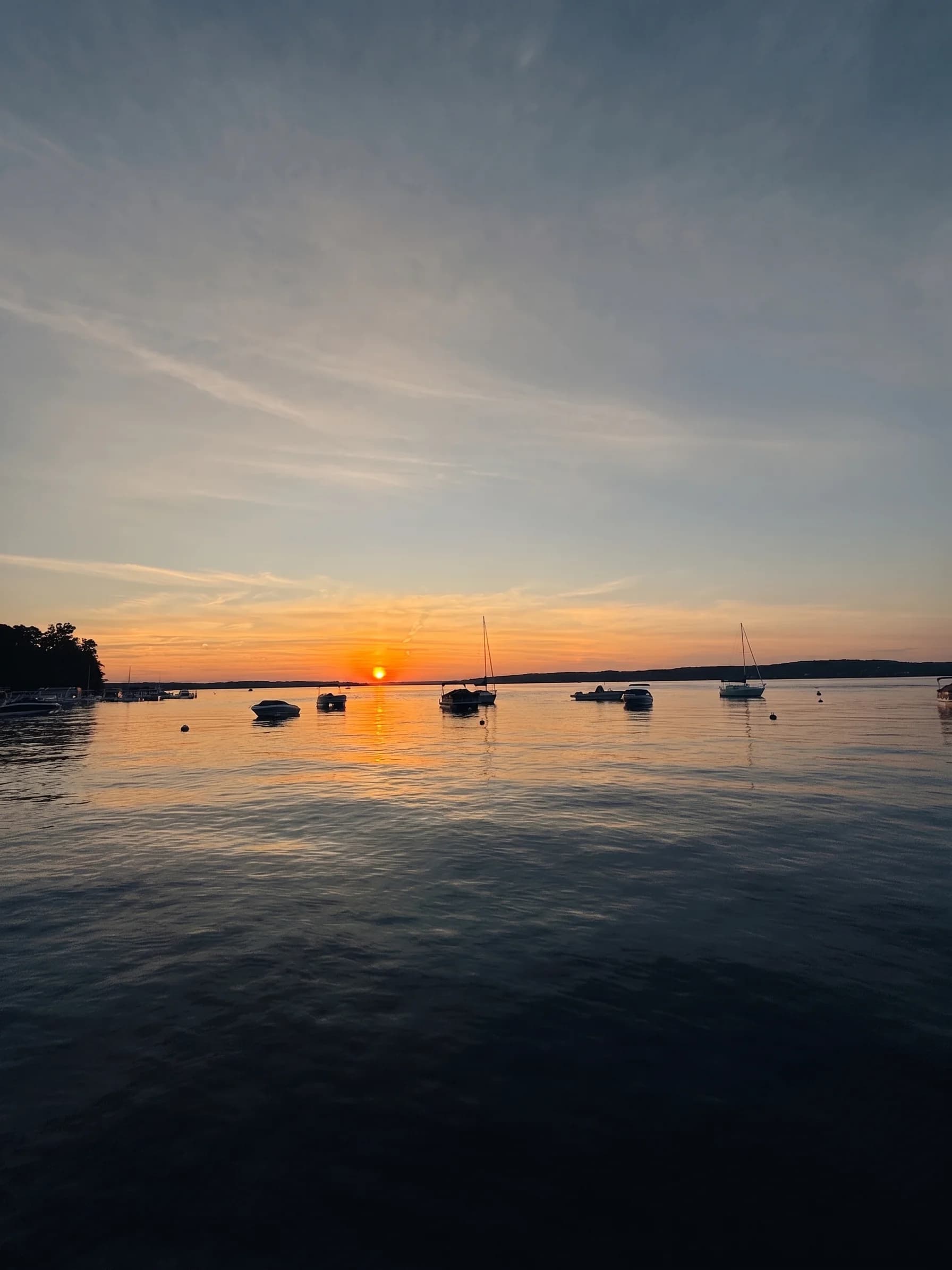 Boats at dusk on Geneva Lake by The Boat House