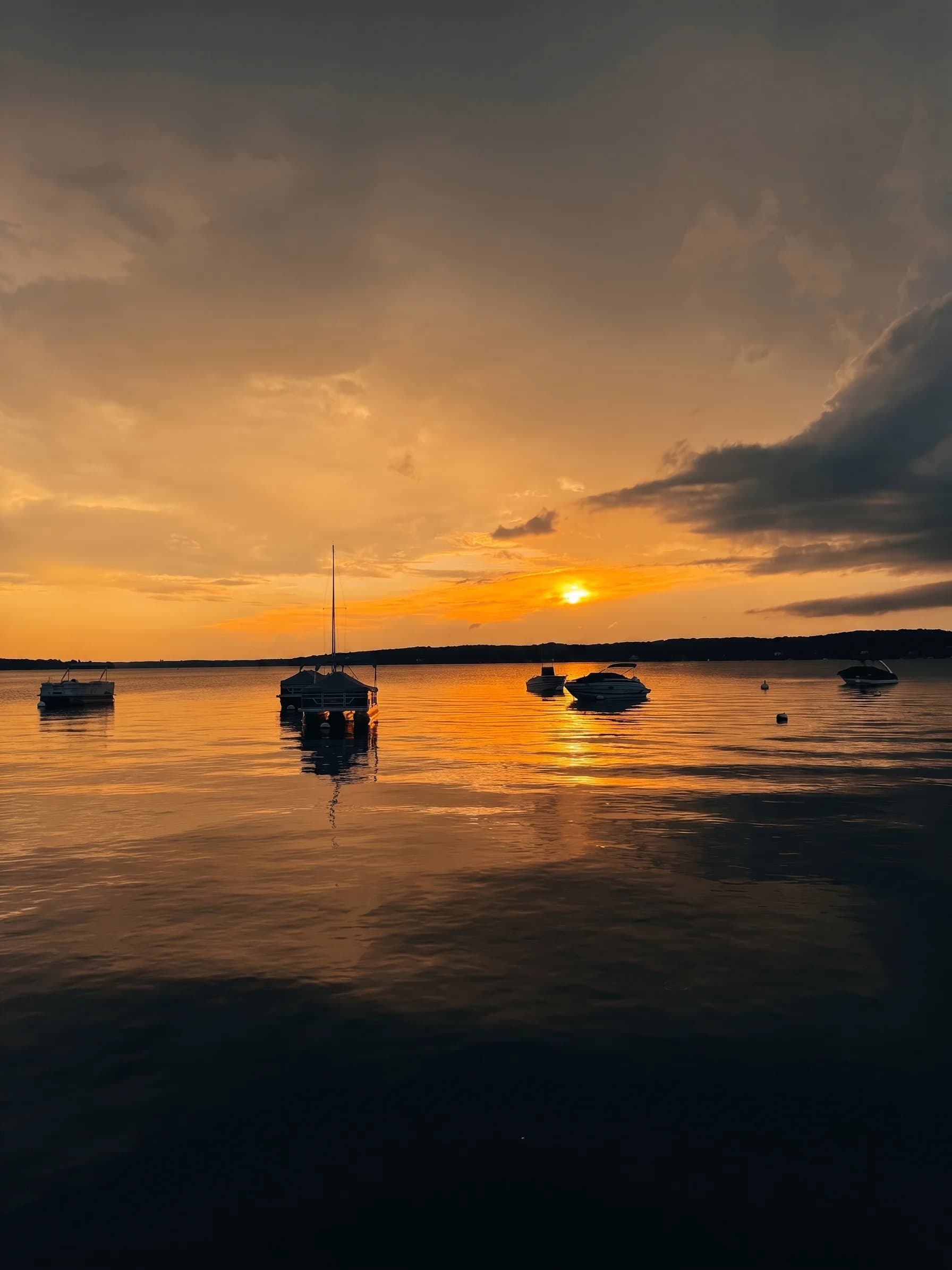 Golden-hour anchorage on Geneva Lake at The Boat House